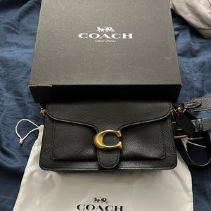 Coach Used 2x pebble leather black hand bag and has adjustable shoulder strap